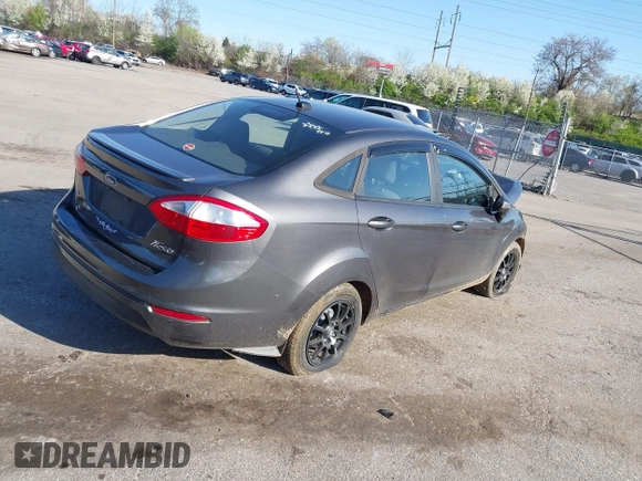 2015 Ford Fiesta SE with VIN 3FADP4BJ1FM128656, listed as a IAAI auction lot 41987997 with 106,588 mi miles. Bid and sale history available at carsss.com. Image 4.