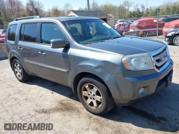 2011 Honda Pilot Touring with VIN 5FNYF4H94BB035415, listed as a IAAI auction lot 42126738 with 239,273 mi miles. Bid and sale history available at carsss.com. Image 1.