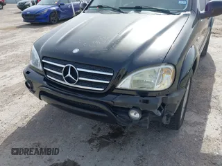 2001 Mercedes-Benz M-Class AMG with VIN 4JGAB74E51A272841, listed as a IAAI auction lot 41734340 with 168,387 mi miles. Bid and sale history available at carsss.com. Image 6.