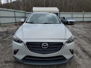2019 Mazda CX-3 Touring with VIN JM1DKFC78K0405131, listed as a Copart auction lot 87065614 with 91,091 mi miles and Salvage Title. Bid and sale history available at carsss.com. Image 5.