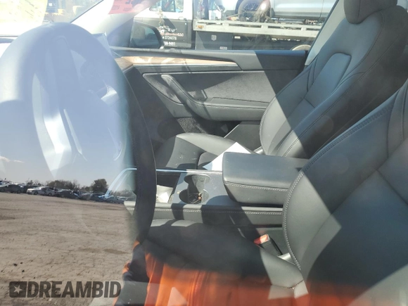 2023 Tesla Model Y Performance z VIN 7SAYGDEF9PF865129, wystawiony jako Copart lot #50228735 z przebiegiem Nie podano mil oraz Szkoda całkowita • Salvage title. Historia ofert i sprzedaży dostępna na DreamBid. Obrazek 7.