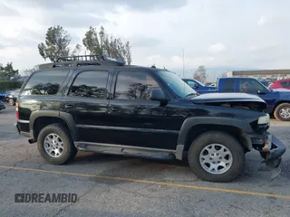 2004 Chevrolet Tahoe LS with VIN 1GNEK13T64R265302, listed as a IAAI auction lot 41445237 with 242,840 mi miles. Bid and sale history available at carsss.com. Image 13.