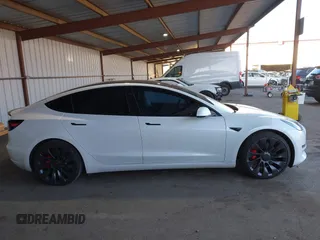 2021 Tesla Model 3 Performance with VIN 5YJ3E1EC4MF097993, listed as a IAAI auction lot 41366615 with 30,735 mi miles and . Bid and sale history available at DreamBid. Image 13.