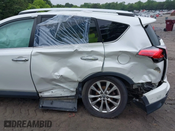 2016 Toyota RAV4 Limited with VIN 2T3YFREV6GW293418, listed as a IAAI auction lot 42367428 with 210,000 mi miles and . Bid and sale history available at DreamBid. Image 6.