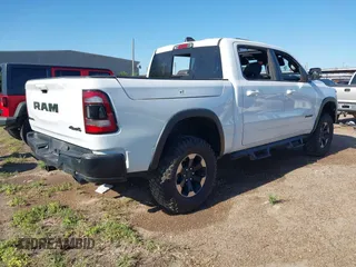 2019 Ram 1500 Rebel z VIN 1C6SRFLT5KN923837, wystawiony jako IAAI lot #41961921 z przebiegiem 68 400 mil mil oraz . Historia ofert i sprzedaży dostępna na DreamBid. Obrazek 4.