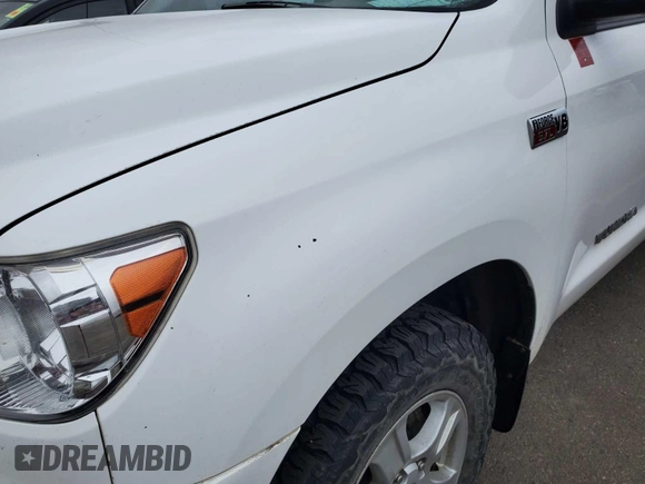 2012 Toyota Tundra z VIN 5TFUY5F14CX236444, wystawiony jako IAAI lot #42304890 z przebiegiem 153 797 mil mil oraz . Historia ofert i sprzedaży dostępna na DreamBid. Obrazek 1.