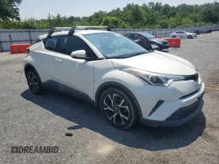 2018 Toyota C-HR XLE with VIN NMTKHMBX6JR027395, listed as a Copart auction lot 63071605 with 124,293 mi miles and Clean title. Bid and sale history available at DreamBid. Image 4.