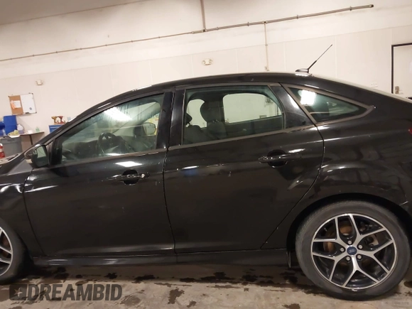 2015 Ford Focus SE with VIN 1FADP3F24FL255450, listed as a IAAI auction lot 41673301 with 103,650 mi miles. Bid and sale history available at carsss.com. Image 14.