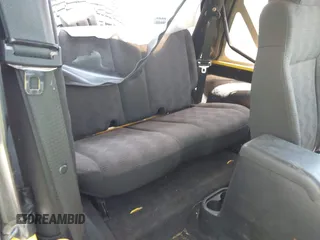 2005 Jeep Wrangler Sport z VIN 1J4FA49S65P381798, wystawiony jako IAAI lot #42305109 z przebiegiem 71 880 mil mil oraz . Historia ofert i sprzedaży dostępna na DreamBid. Obrazek 8.