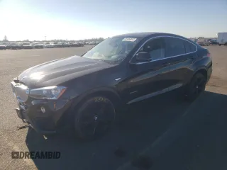 2015 BMW X4 xDrive28i with VIN 5UXXW3C53F0M87790, listed as a Copart auction lot 65936083 with 0 mi miles. Bid and sale history available at carsss.com. Image 1.
