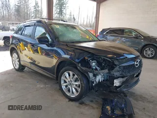2014 Mazda CX-5 Grand Touring with VIN JM3KE2DY6E0394172, listed as a IAAI auction lot 41698468 with 89,554 mi miles. Bid and sale history available at carsss.com. Image 1.
