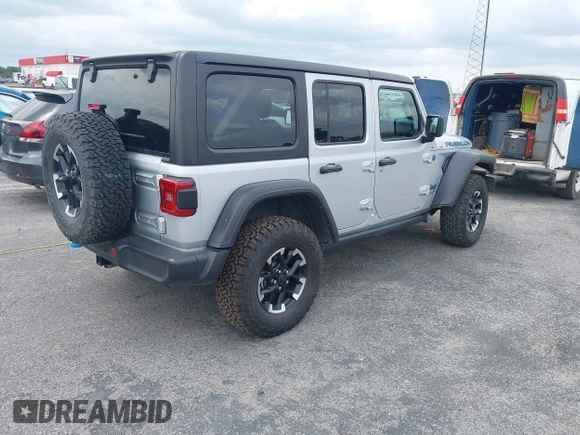 2024 Jeep Wrangler Rubicon with VIN 1C4RJXR61RW224506, listed as a IAAI auction lot 42111434 with 33,689 mi miles and . Bid and sale history available at DreamBid. Image 4.
