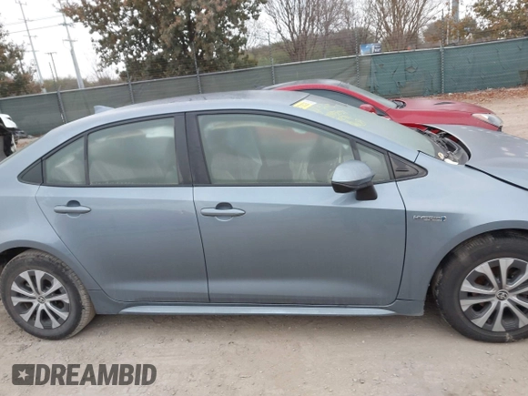 2021 Toyota Corolla Hybrid LE with VIN JTDEAMDE8MJ002711, listed as a IAAI auction lot 41498716 with 98,559 mi miles. Bid and sale history available at carsss.com. Image 12.