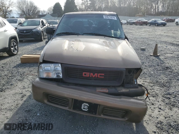 2003 GMC Sonoma SLS z VIN 1GTCS19X538182443, wystawiony jako Copart lot #84875374 z przebiegiem Nie podano mil oraz Szkody całkowita. Historia ofert i sprzedaży dostępna na DreamBid. Obrazek 5.