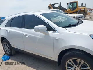 2021 Cadillac XT5 FWD Premium Luxury z VIN 1GYKNCR42MZ174309, wystawiony jako IAAI lot #42051341 z przebiegiem 75 544 mil mil oraz . Historia ofert i sprzedaży dostępna na DreamBid. Obrazek 13.