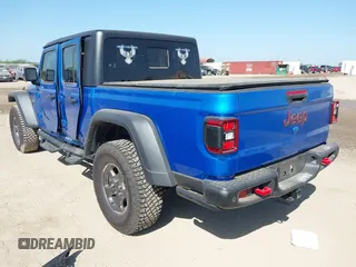 2023 Jeep Gladiator Rubicon with VIN 1C6JJTBG3PL581023, listed as a IAAI auction lot 41963931 with 15,023 mi miles and . Bid and sale history available at DreamBid. Image 3.