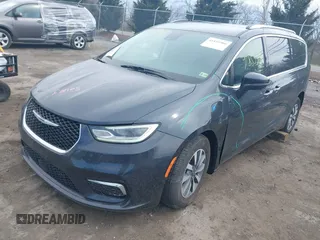 2021 Chrysler Pacifica Hybrid Touring L z VIN 2C4RC1L7XMR593987, wystawiony jako IAAI lot #41855966 z przebiegiem 72 685 mil mil oraz . Historia ofert i sprzedaży dostępna na DreamBid. Obrazek 2.