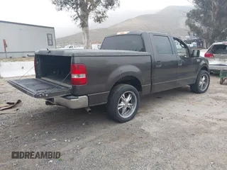 2005 Ford F-150 XLT with VIN 1FTRW12W15KE64553, listed as a IAAI auction lot 42009373 with 106,454 mi miles. Bid and sale history available at carsss.com. Image 4.