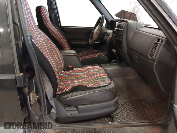 1999 Jeep Cherokee Sport z VIN 1J4FF68S4XL668081, wystawiony jako IAAI lot #42304649 z przebiegiem 194 470 mil mil oraz . Historia ofert i sprzedaży dostępna na DreamBid. Obrazek 5.