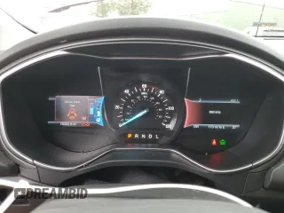 2016 Ford Fusion Titanium Hybrid with VIN 3FA6P0RU7GR187877, listed as a Copart auction lot 88923615 with 76,322 mi miles and Salvage Title. Bid and sale history available at carsss.com. Image 9.