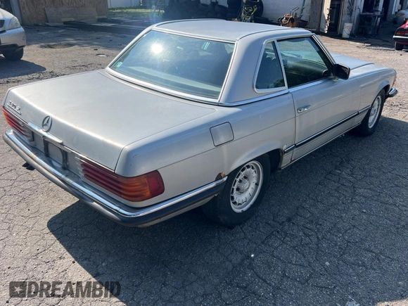 1984 Mercedes-Benz SL with VIN WDB1070421A009542, listed as a Copart auction lot 65327125 with 142,656 mi miles and Clean title. Bid and sale history available at DreamBid. Image 4.