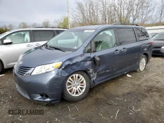 2015 Toyota Sienna XLE with VIN 5TDYK3DC4FS643475, listed as a Copart auction lot 52697405 with 153,808 mi miles and Salvage Title. Bid and sale history available at DreamBid. Image 1.