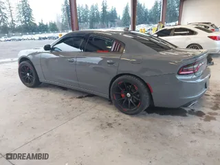 2019 Dodge Charger SXT with VIN 2C3CDXJG2KH547683, listed as a IAAI auction lot 41232974 with 75,960 mi miles. Bid and sale history available at carsss.com. Image 3.