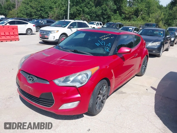 2013 Hyundai Veloster w/Black Int with VIN KMHTC6AD9DU135318, listed as a IAAI auction lot 42632212 with 97,485 mi miles and . Bid and sale history available at DreamBid. Image 2.