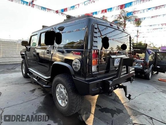 2003 Hummer H2 with VIN 5GRGN23U23H145183, listed as a Copart auction lot 84566884 with 85,945 mi miles and Clean Title. Bid and sale history available at carsss.com. Image 3.