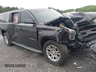 2015 GMC Yukon XL SLE z VIN 1GKS1GKC8FR507436, wystawiony jako IAAI lot #42113696 z przebiegiem Nie podano mil oraz . Historia ofert i sprzedaży dostępna na DreamBid. Obrazek 1.