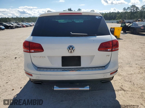 2014 Volkswagen Touareg Lux z VIN WVGEF9BP4ED011436, wystawiony jako Copart lot #74207144 z przebiegiem 207 059 mil mil oraz Szkoda całkowita • Salvage title. Historia ofert i sprzedaży dostępna na DreamBid. Obrazek 6.