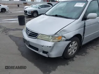 2003 Honda Odyssey EX-L with VIN 5FNRL18943B030373, listed as a IAAI auction lot 41867289 with 179,718 mi miles and . Bid and sale history available at DreamBid. Image 6.