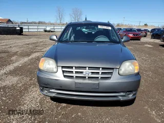 2005 Hyundai Accent GLS with VIN KMHCG35C65U331867, listed as a Copart auction lot 49637495 with 63,901 mi miles and Clean Title. Bid and sale history available at carsss.com. Image 5.