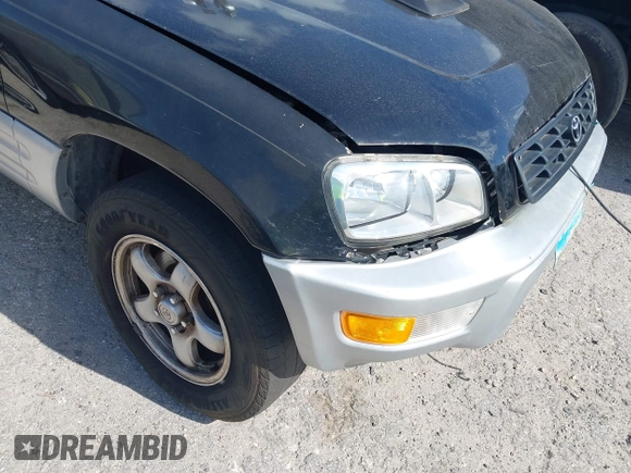 1998 Toyota RAV4 with VIN JT3GP10V7W7037711, listed as a IAAI auction lot 42081313 with 233,554 mi miles and . Bid and sale history available at DreamBid. Image 13.