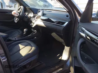 2017 BMW X1 sDrive28i with VIN WBXHU7C30H5H32753, listed as a IAAI auction lot 41441791 with 100,072 mi miles. Bid and sale history available at carsss.com. Image 5.