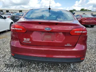 2016 Ford Focus SE z VIN 1FADP3F22GL355192, wystawiony jako Copart lot #56614225 z przebiegiem 56 214 mil mil oraz Szkoda całkowita • Salvage title. Historia ofert i sprzedaży dostępna na DreamBid. Obrazek 6.