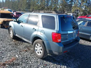 2010 Mazda Tribute Touring with VIN 4F2CY9C73AKM04595, listed as a IAAI auction lot 40797681 with 122,774 mi miles. Bid and sale history available at carsss.com. Image 3.