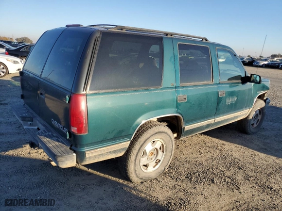 1995 Chevrolet Tahoe with VIN 1GNEK13K0SJ445250, listed as a Copart auction lot 82987024 with 125,517 mi miles and Salvage Title. Bid and sale history available at carsss.com. Image 3.