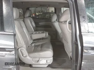 2012 Honda Odyssey EX-L with VIN 5FNRL5H63CB137198, listed as a IAAI auction lot 42706690 with 305,753 mi miles and . Bid and sale history available at DreamBid. Image 8.