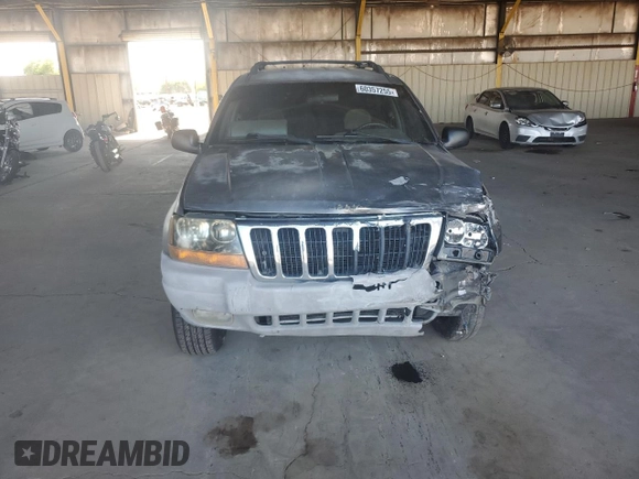 2000 Jeep Grand Cherokee Laredo with VIN 1J4GW48S0YC253091, listed as a Copart auction lot 60357255 with 218,410 mi miles and Clean title. Bid and sale history available at DreamBid. Image 5.