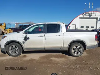 2020 Honda Ridgeline RTL with VIN 5FPYK3F50LB028430, listed as a IAAI auction lot 42033090 with Not provided miles and . Bid and sale history available at DreamBid. Image 14.