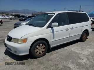 2003 Honda Odyssey EX-L z VIN 5FNRL18073B111756, wystawiony jako Copart lot #57709205 z przebiegiem 87 373 mil mil oraz Czysty tytuł • Clean title. Historia ofert i sprzedaży dostępna na DreamBid. Obrazek 1.