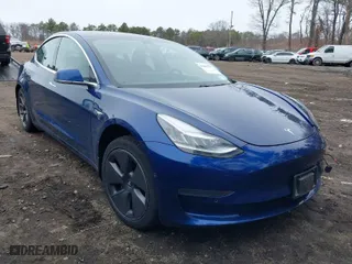 2020 Tesla Model 3 Standard Range Plus with VIN 5YJ3E1EA1LF658521, listed as a IAAI auction lot 41804722 with 83,248 mi miles. Bid and sale history available at carsss.com. Image 1.