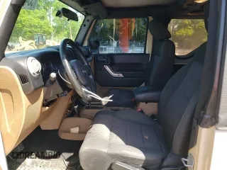 2011 Jeep Wrangler Sahara z VIN 1J4AA5D10BL528862, wystawiony jako Copart lot #53488515 z przebiegiem 198 865 mil mil oraz Szkoda całkowita • Salvage title. Historia ofert i sprzedaży dostępna na DreamBid. Obrazek 7.