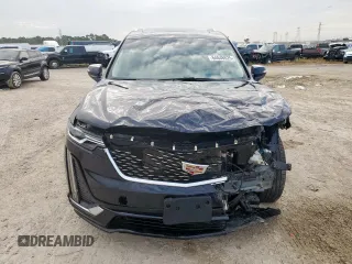 2022 Cadillac XT6 Premium Luxury with VIN 1GYKPCRS1NZ152828, listed as a Copart auction lot 64646525 with 18,913 mi miles and Salvage title. Bid and sale history available at DreamBid. Image 5.