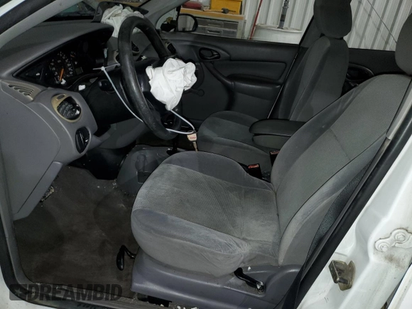 2002 Ford Focus LX with VIN 1FAFP33P52W126344, listed as a Copart auction lot 49757324 with 140,612 mi miles and Salvage Title. Bid and sale history available at DreamBid. Image 7.