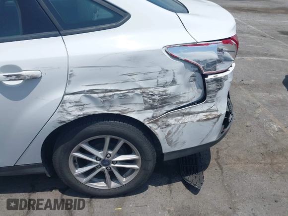 2017 Ford Focus SE with VIN 1FADP3F21HL217838, listed as a IAAI auction lot 42560331 with 154,406 mi miles and . Bid and sale history available at DreamBid. Image 6.