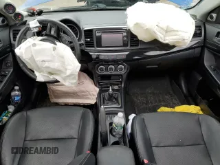 2015 Mitsubishi Lancer Evolution GSR z VIN JA32W8FV7FU023106, wystawiony jako Copart lot #40867084 z przebiegiem 103 964 mil mil oraz Szkody całkowita. Historia ofert i sprzedaży dostępna na DreamBid. Obrazek 8.