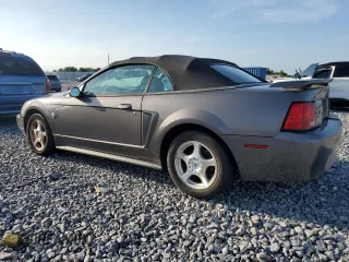 2004 Ford Mustang Deluxe z VIN 1FAFP44674F177195, wystawiony jako Copart lot #65935855 z przebiegiem 928 945 mil mil oraz Czysty tytuł • Clean title. Historia ofert i sprzedaży dostępna na DreamBid. Obrazek 2.