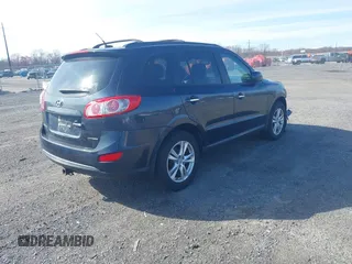 2012 Hyundai Santa Fe Limited z VIN 5XYZKDAG3CG130695, wystawiony jako IAAI lot #41880175 z przebiegiem 152 727 mil mil oraz . Historia ofert i sprzedaży dostępna na DreamBid. Obrazek 4.